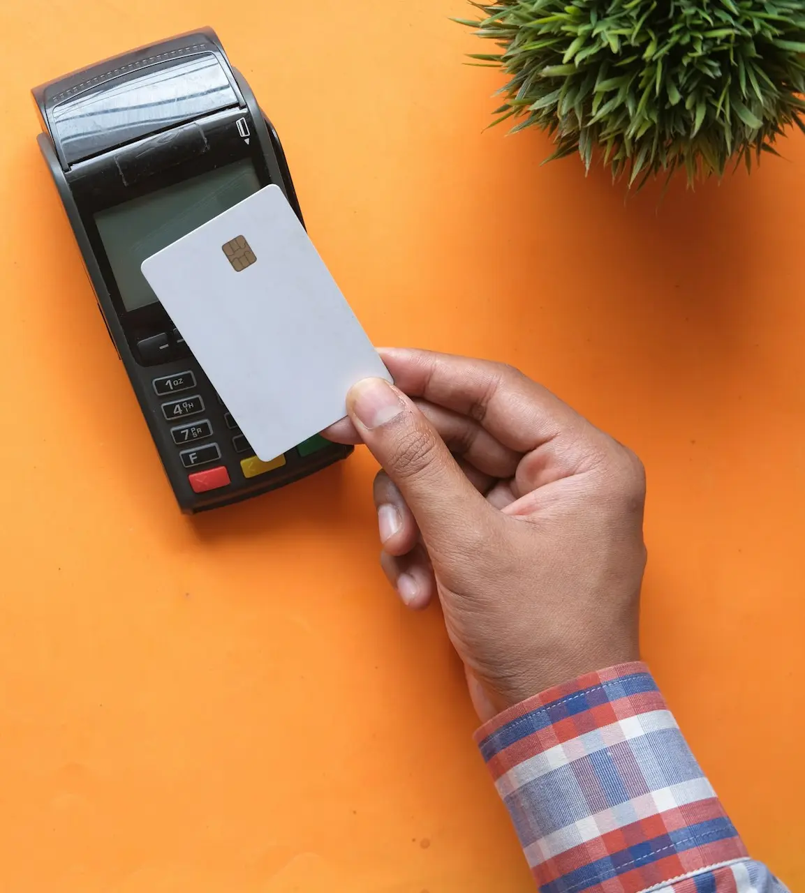 person holding black and white electronic device