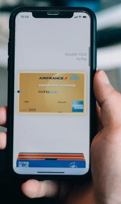 person holding white iphone 5 c